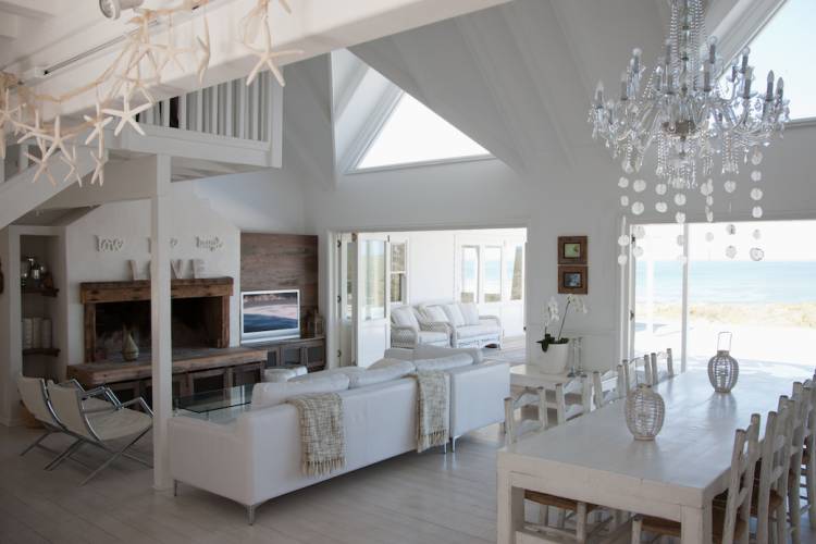 Interior of open plan living and dining room of an elegant coastal home